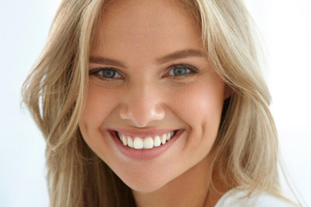 Picture of a blonde woman smiling back at the camera