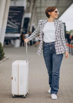 Picture of a woman holding her suitcase