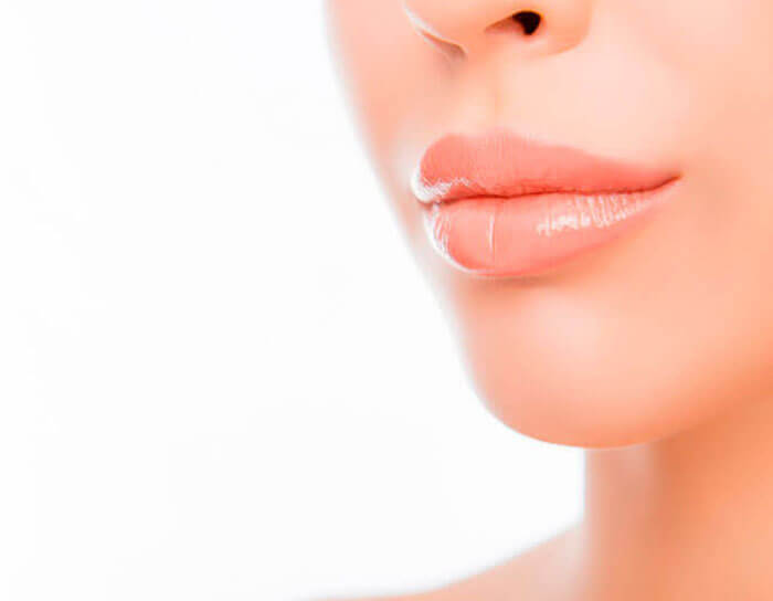 Picture of a woman happy with her fat transfer to the lips procedure.